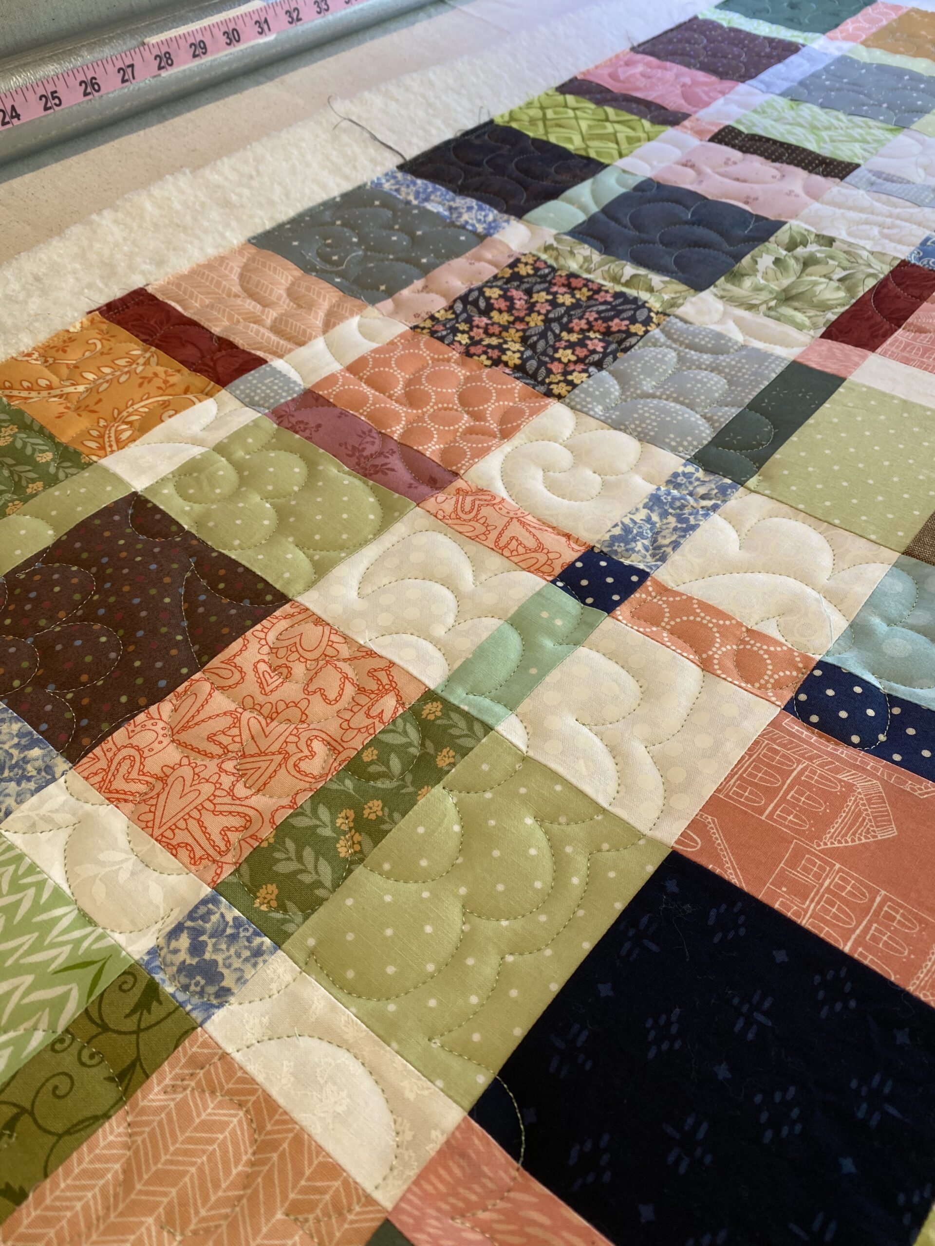 Susie holding a quilt